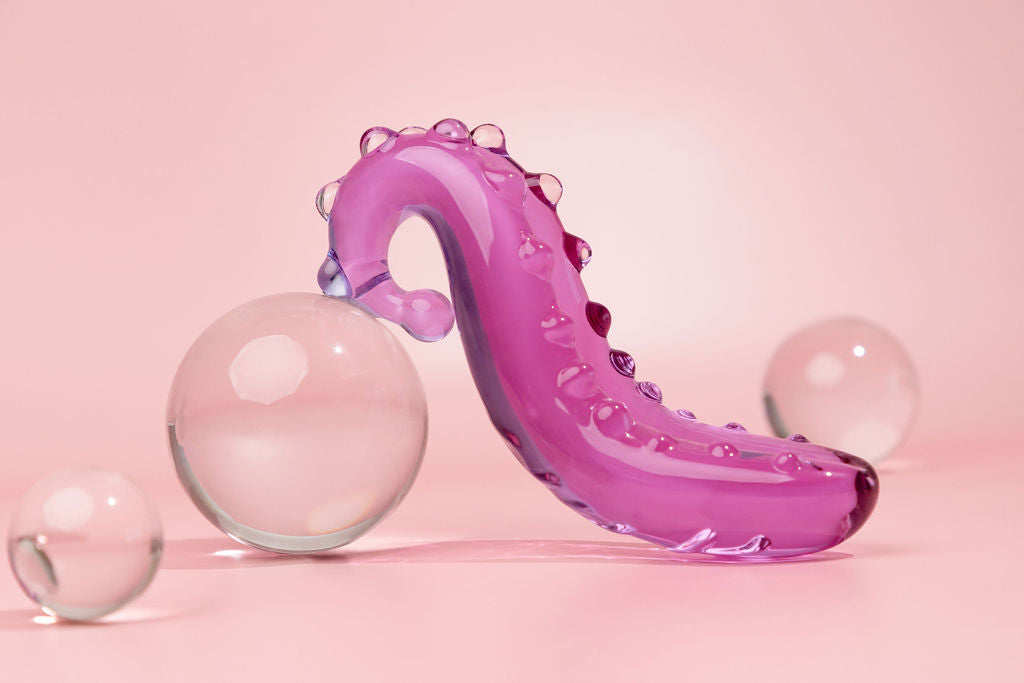 Lilac Sacred Squirter. Glass Pleasure wand with ridges pictured with bubbles.